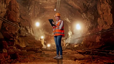 Female Engineer Working On A Tablet In Mine Tunnel Stock Footage 299580286