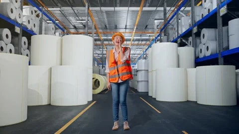 Female Engineer Yelling With Hand Over Mouth at Polymer Plant Stock Footage 334533309