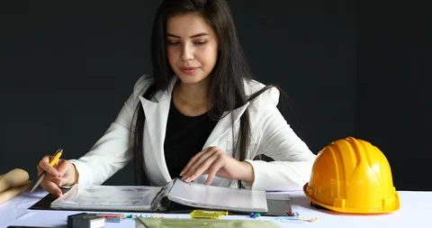 Female engineering manager reading check report document file Stock Footage 86943693