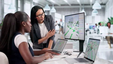 Female Engineers Analyzing City Road Data Using Computer Stock Footage 334528698