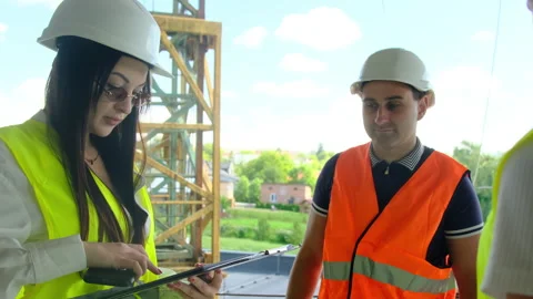 Female engineers and builder analyze technical documents Video stock 317616944