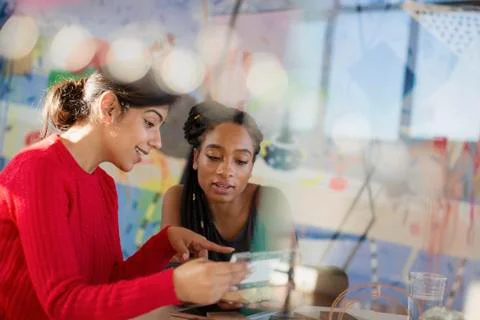 Female engineers examining prototype Stock Photos