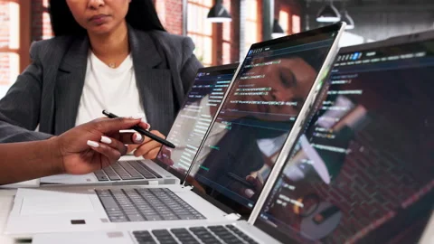 Female Engineers Reviewing Code On Laptop While Sitting Stock Footage 333845977