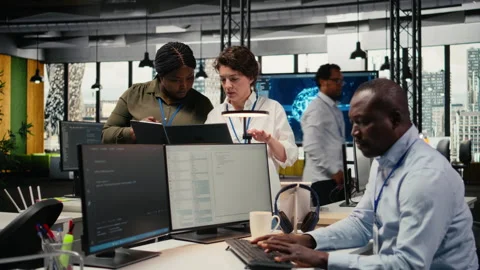 Female engineers in startup office using AI technology driving market innovation Stock Footage 323029703