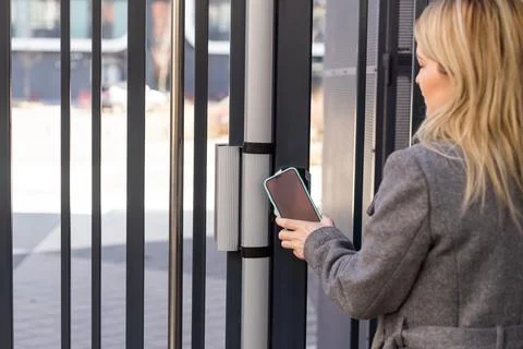 Female entering secret key code for getting access and passing building using 스톡 사진
