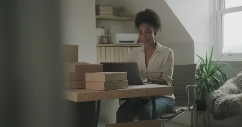 Female Entrepreneur Preparing Parcel Boxes for Shipment at Home Stock Footage 166807959