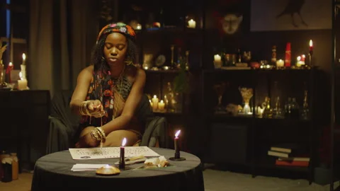 Female Esotericist Having Session with Pendulum Stock Footage 247637110