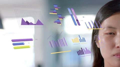 Female exec turning head smiling to 3D charts entering beside her, showing Stock Footage 333278360