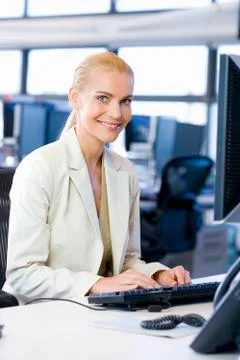 Female executive using computer Stock Photos
