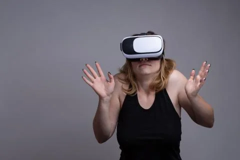 Female experiencing virtual reality. Activity simulator for fun and recreation Stock-Fotos