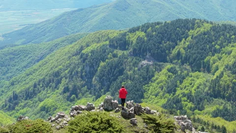 Female Explorer Enjoying Remote Mountain Scenery in Spring at Beklemeto Stock Footage 310365111