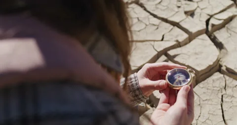 Female Explorer Holds Up A Compass Stock Footage 238554104