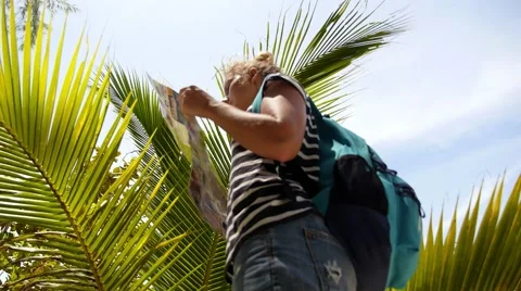 Female Explorer Looking at Map Outdoors. Slow Motion. Stock-Footage 42671330
