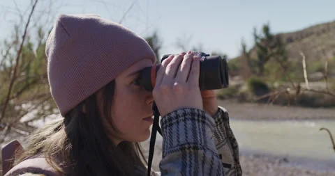 Female Explorer Looking Through Binoculars Rack Focus Stock Footage 238553596