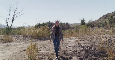 Female Explorer Walks on Sand Stock Footage 238554153