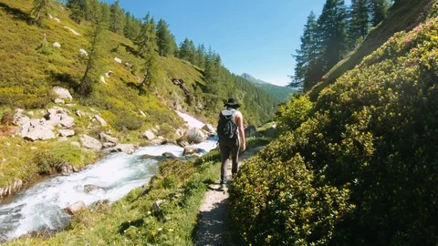 Female exploring alpine valley Stock Footage 116706061