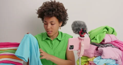 Female expret knows everything about clothes and fabric talks with followers Stock Footage 157337086