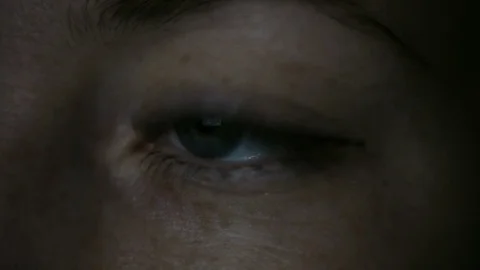 Female eye in the dark Stock Footage 69795932