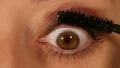 Female eye expression closeup - rimmel, mascara application HD Footage