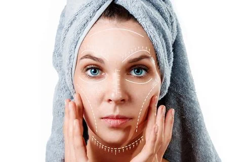 Female face close-up with pattern and arrows on a white background. The conce Stock Photos