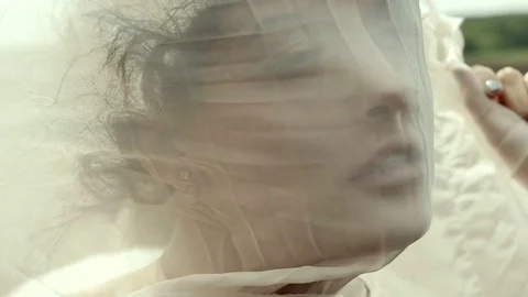 Female face through tissue 库存影片 76203649