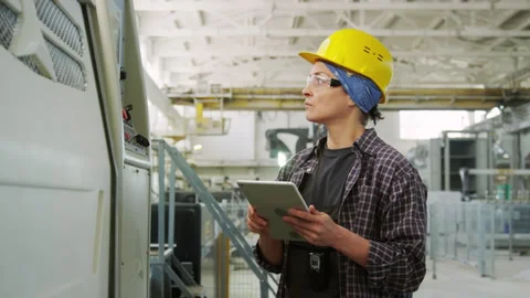 Female Factory Inspector with Tablet Using Machine and Posing on Camera Stock Footage 248420508
