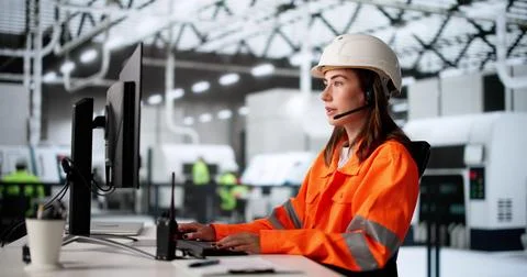 Female Factory Worker Using Computer In Industrial Production Automation Syst Stock Photos