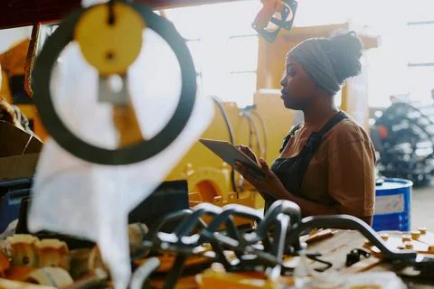 Female Factory Worker Using Digital Tablet 写真素材
