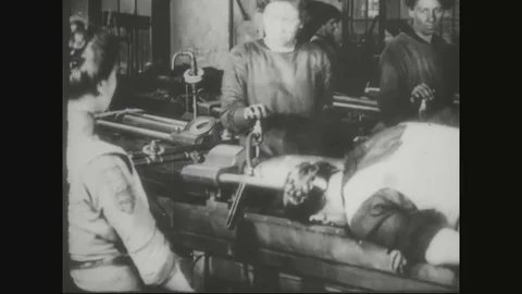 Female factory workers working in shell factory and inspecting shells - 1918 Stock Footage 83657478