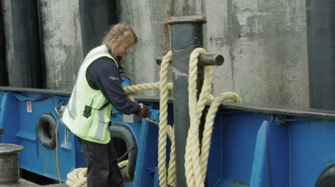 Female ferry worker with ropes Stock Footage 58860719