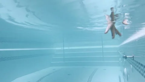 Female Fingers Moving with Reflection Underwater in Swimming Pool Stock Footage 272762425