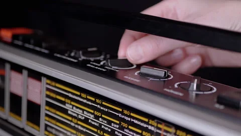 Female Fingers Spinning the Knobs Volume on an Old Tape Recorder. Zoom Video stock 170668538