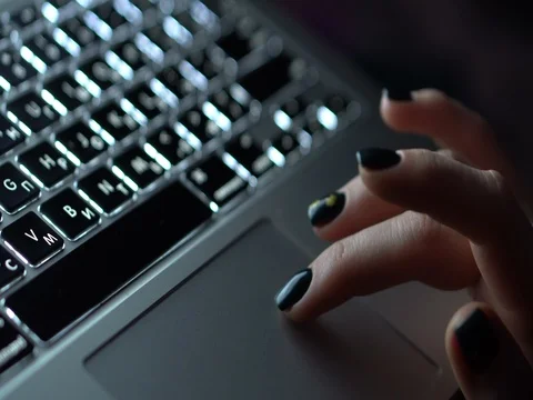 Female fingers touch the laptop's touchpad Stock Footage 80896078