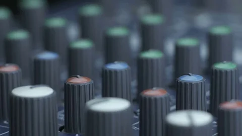 Female fingers turning equalizer knobs on mixer Video stock 84991310