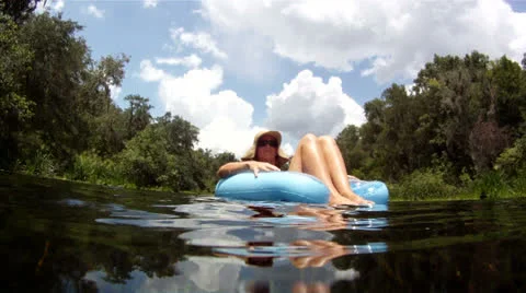 Female on Float, Summer River Fun Stock Footage 25002275