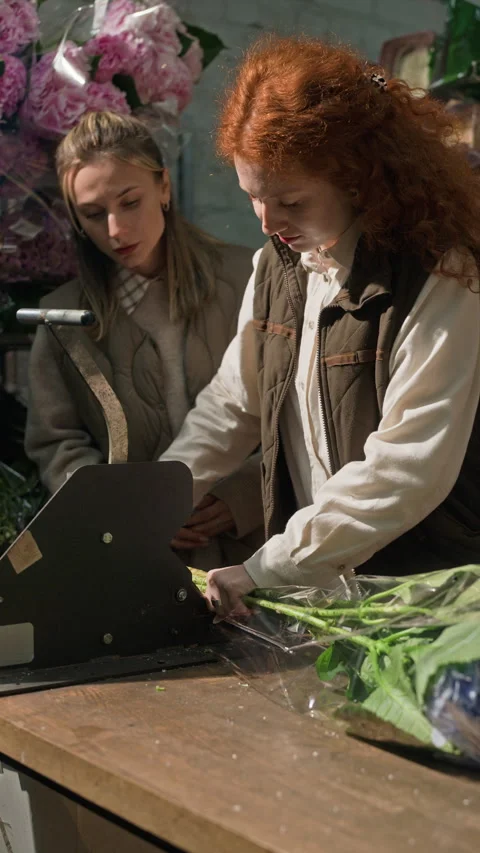 Female Florists Cutting Hydrangea Stems in Wholesale Warehouse Stock-Footage 343619376
