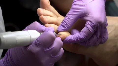 Female foot in the process of pedicure procedure in a beauty salon. Close-up. Video stock 102778797