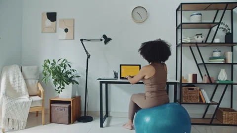 Female Freelance Worker Coding on Laptop on Fitness Ball at Home Stock-Footage 269019163