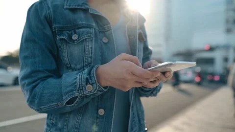 Female freelance worker using smartphone outdoors Stock Footage 195095773