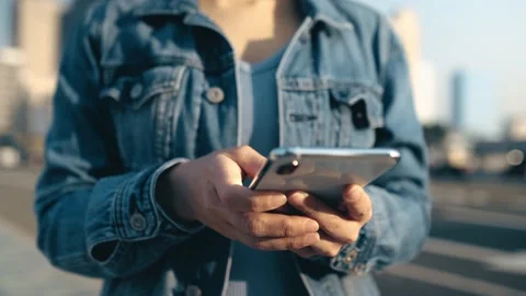 Female freelance worker using smartphone outdoors Stock Footage 195095855