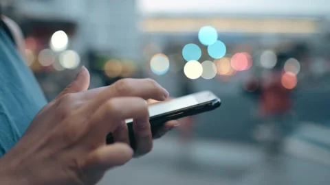 Female freelance worker using smartphone outdoors Stock Footage 195096253
