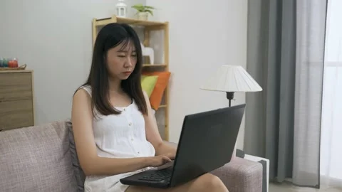 Female freelance worker working on the computer 動画素材 154952421