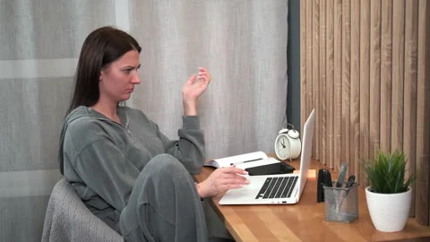 A female freelancer feels surprised while working using a laptop. Stock Footage 301660878