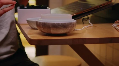 Female freelancer in kitchen turning on essential oil diffuser Video stock 128814515