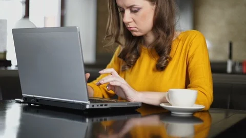 Female freelancer using laptop for working on project in co-working place Stock Footage 106266106