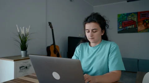 Female freelancer writes content for website on laptop Stock Footage 228923658