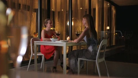 Female Friends Enjoy Night Out At luxury restaurant Stock Footage