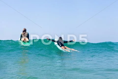 Female Friends Surfing, Hermosa Beach, California, Usa