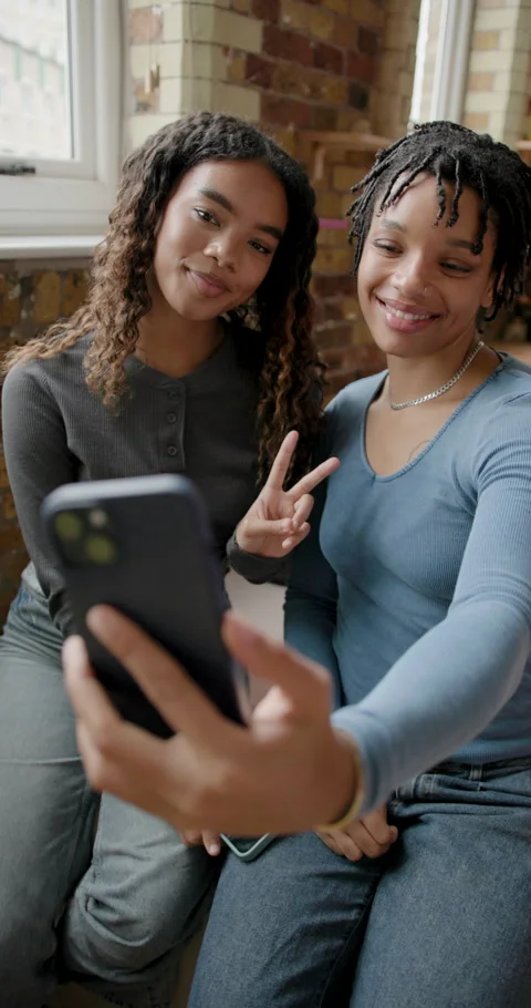 Female Friends taking Selfie using Phone Stock Footage 297276928