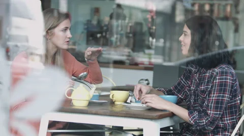 Female friends talking in coffee shop Stock-Footage 59167557